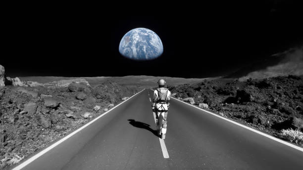 istock Astronaut walking down a road on the moon. Going home to earth 1387453775