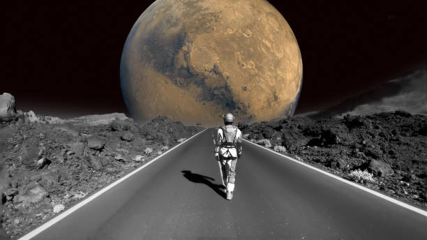 istock Astronaut walking down a road on the moon. Going home to mars 1387453817