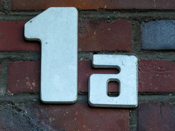 istock Metal house number on a wall 1387456096