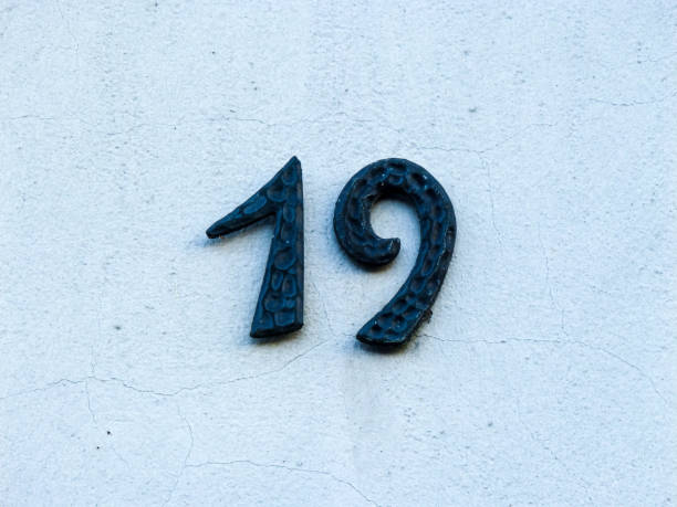 istock Metal house number on a wall 1387456107
