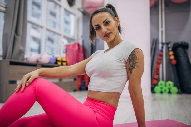 istock Charming woman in gym 1387456129
