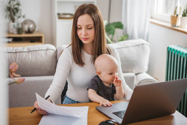 istock Young mother working from home 1387459395