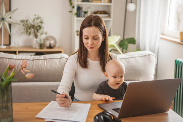 istock Young mother working from home 1387459405