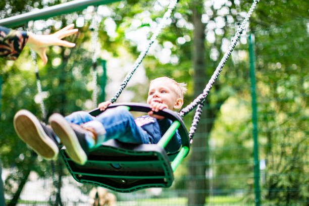 istock Preschool boys enjoying at playground 1387459478
