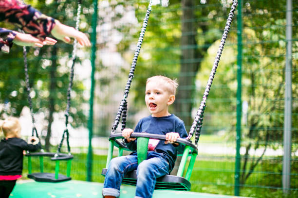 istock Preschool boys enjoying at playground 1387459489