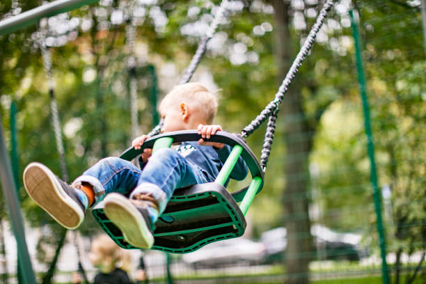 istock Preschool boys enjoying at playground 1387459500