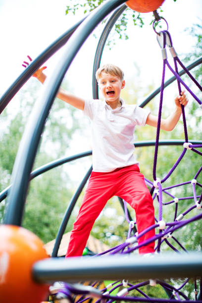 istock Preschool boys enjoying at playground 1387459545