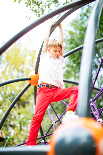 istock Preschool boys enjoying at playground 1387459549