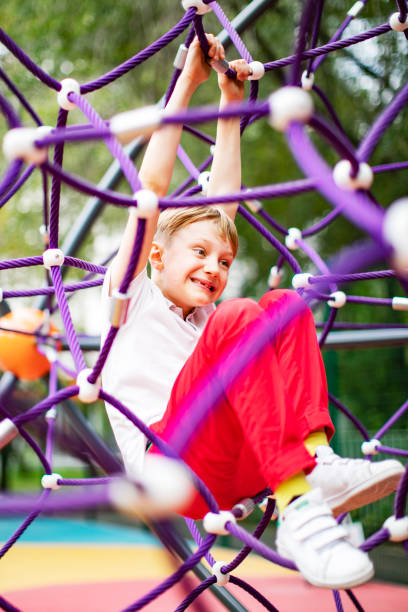 istock Preschool boys enjoying at playground 1387459555