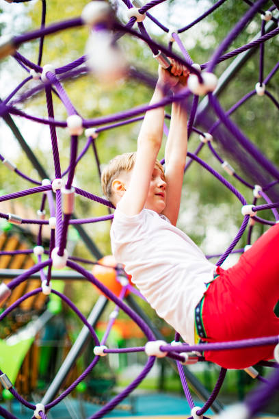 istock Preschool boys enjoying at playground 1387459558