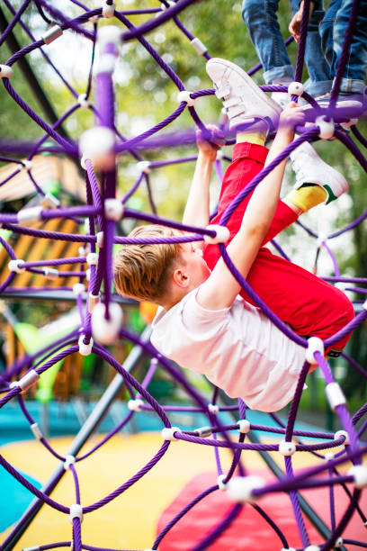 istock Preschool boys enjoying at playground 1387459560