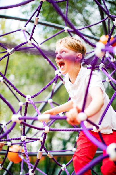 istock Preschool boys enjoying at playground 1387459562