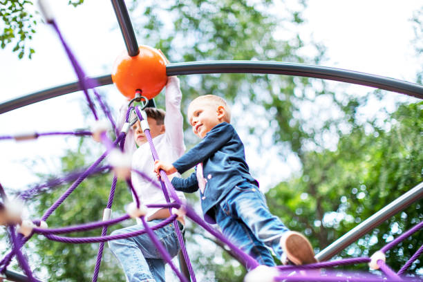 istock Preschool boys enjoying at playground 1387459566