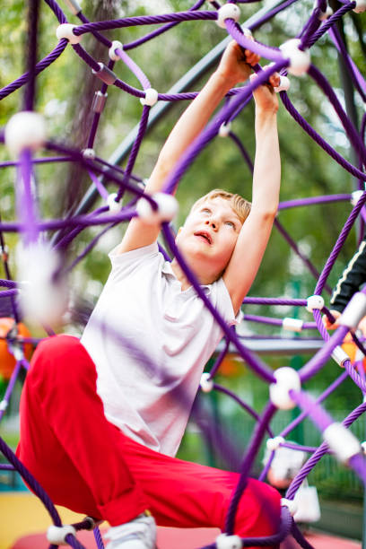 istock Preschool boys enjoying at playground 1387459567