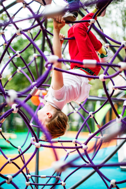 istock Preschool boys enjoying at playground 1387459568