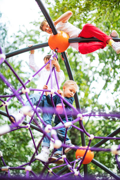 istock Preschool boys enjoying at playground 1387459576