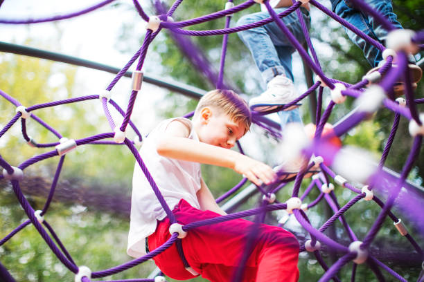 istock Preschool boys enjoying at playground 1387459580