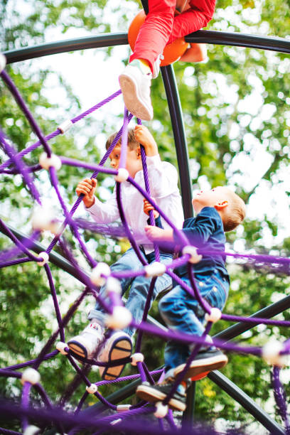 istock Preschool boys enjoying at playground 1387459586