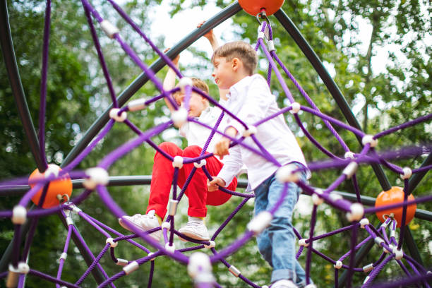 istock Preschool boys enjoying at playground 1387459618