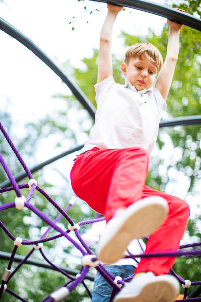 istock Preschool boys enjoying at playground 1387459619