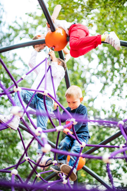 istock Preschool boys enjoying at playground 1387459622