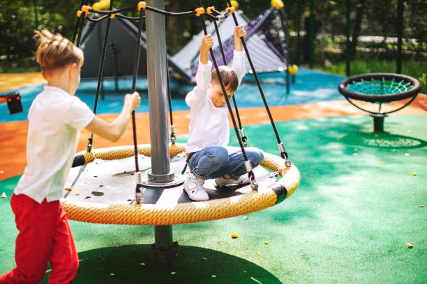 istock Preschool boys enjoying at playground 1387459633