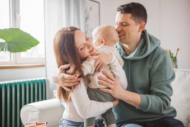 istock Young family at home 1387459686