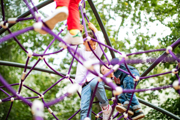 istock Preschool boys enjoying at playground 1387459688