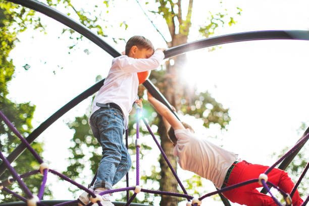 istock Preschool boys enjoying at playground 1387459732