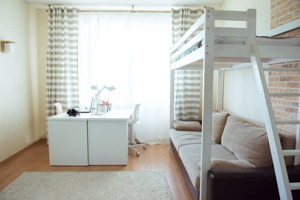 istock Interior of children room with desk, sofa and bunk bed 1387459767