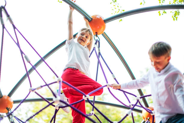 istock Preschool boys enjoying at playground 1387459816