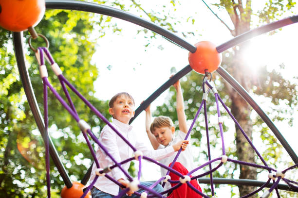 istock Preschool boys enjoying at playground 1387459819