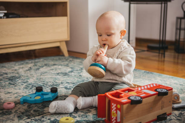 istock Baby exploring toys 1387459851