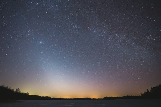 istock Night landscape image with colorful milky way and zodiac light in the horizon 1387460077