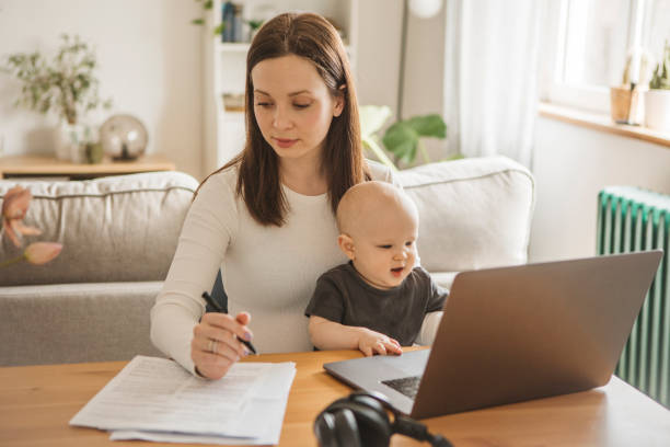 istock Young mother working from home 1387461174