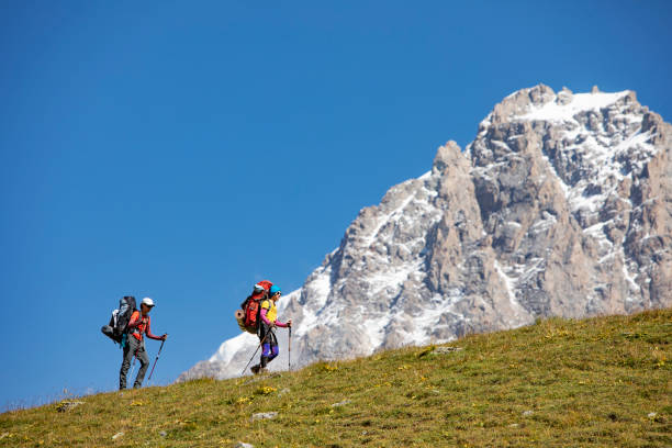 istock Friends trekking in Caucasus mountains 1387462642