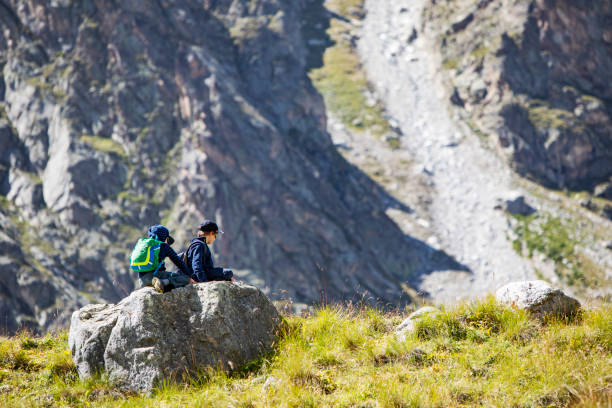 istock Brothers trekking in mountains 1387462724