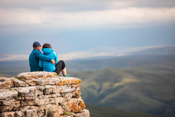 istock Young couple trekking in mountains 1387462829