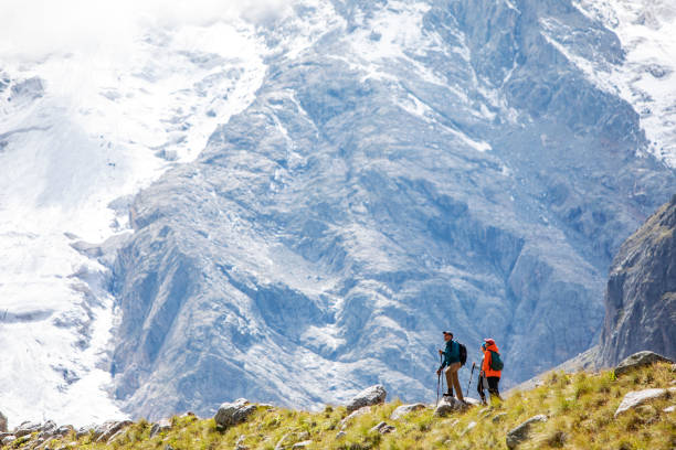 istock Friends trekking in mountains 1387462837