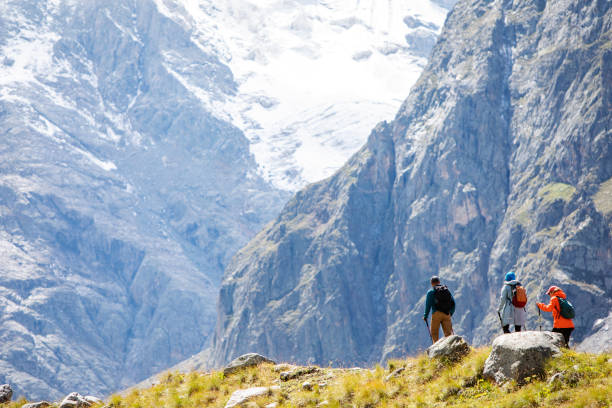 istock Friends trekking in mountains 1387462871