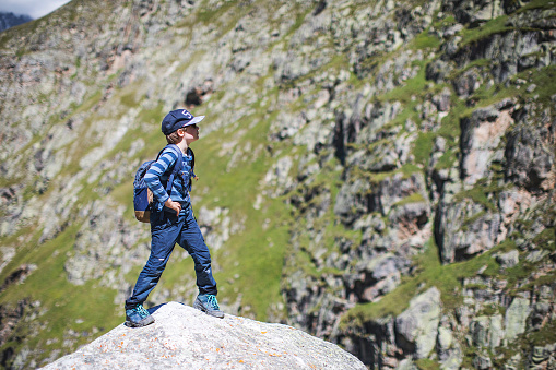 Preschool boy trekking in Caucasus mountains