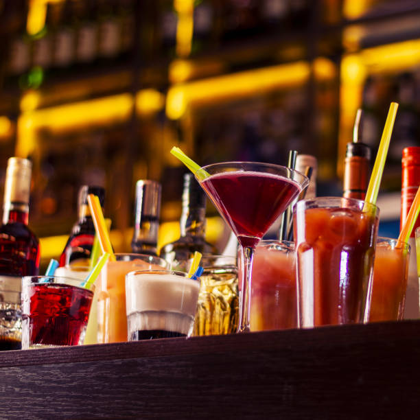 istock colorful coctails on wooden bar table 1387464415