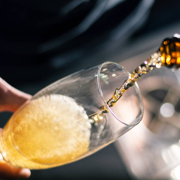 istock barman pour beer to the glass 1387464423