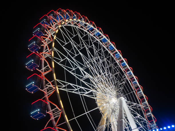 istock Part of a Ferris Wheel with at night time 1387466611