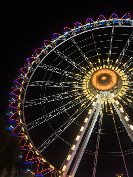 istock Part of a Ferris Wheel at night time 1387466625
