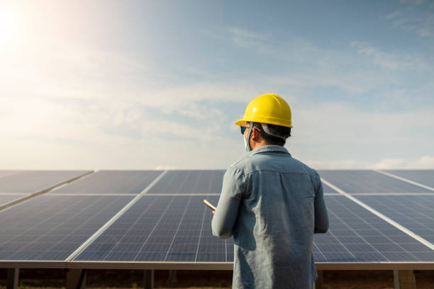 istock Renewable Energy Power Plant Technician, Solar Panel in Thailand 1387469728
