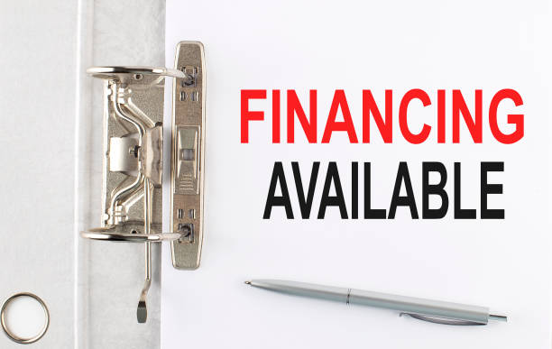 istock FINANCING AVAILABLE text on the paper folder with pen. Business concept 1387472101