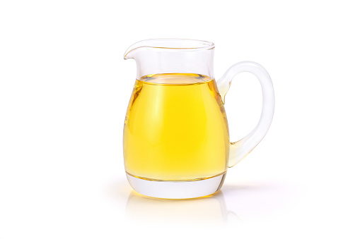 Vegetable oil in glass bottle isolated on white background. Clipping path.
