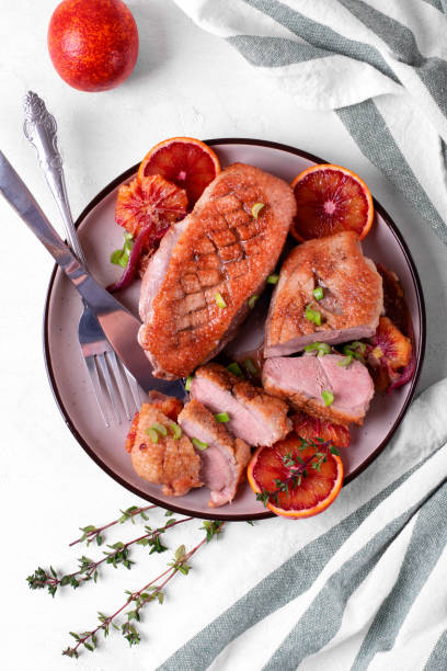 istock Roasted duck breast with blood oranges 1387475434