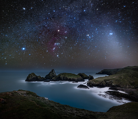 Kynance Cove underneath Orion and Zodiacal Light.\n\nZodiacal light is best seen whilst close to the equinox and without a moon in the sky. It's also only visible for a couple of hours after dusk so I had to get out early for once!\n\nZodiacal Light is caused by millions of tiny particles in the plane of Earth's solar system. The solar system was born more than 4.5 billion years ago as a rotating cloud of gas and dust surrounded the new sun. This cloud coalesced into the objects now known as planets and asteroids, but some of the original dust was left behind.